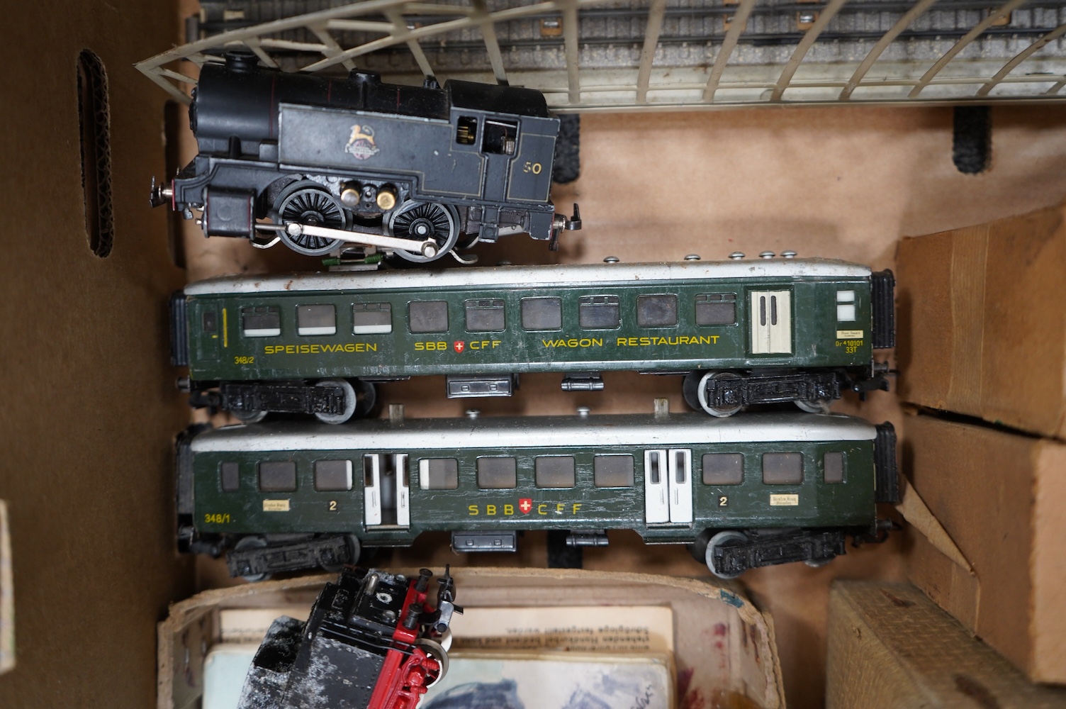 A collection of HO gauge Marklin and Trix Twin Railway tinplate and diecast rolling stock and track, including; including a German 2-10-0 tender locomotive with bogie tender, G800, two Trix 0-4-0T locomotives, one boxed,